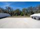 View of large, fenced backyard with concrete pad and hot tub at 1097 Hendon Loop, Davenport, FL 33837