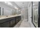 Spacious bathroom with double vanity, a walk-in shower, and modern fixtures at 1097 Hendon Loop, Davenport, FL 33837