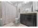 Clean bathroom featuring a shower, toilet, and a vanity with storage at 1097 Hendon Loop, Davenport, FL 33837