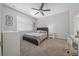 Cozy bedroom featuring a bed, nightstand, and a window with natural light at 1097 Hendon Loop, Davenport, FL 33837