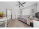 Bedroom with a bed, a desk with chair, and a window with natural light at 1097 Hendon Loop, Davenport, FL 33837