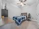 Neat bedroom featuring a bed, dresser, and a window with natural light at 1097 Hendon Loop, Davenport, FL 33837