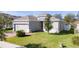 Charming single-Gathering home featuring a well-maintained lawn, brick driveway, and two-car garage at 1097 Hendon Loop, Davenport, FL 33837