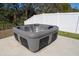 Modern hot tub with seating and jets on concrete pad at 1097 Hendon Loop, Davenport, FL 33837
