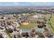 Aerial view of community amenities including the recreation center, baseball field, tennis courts and basketball courts at 1238 James Ln, Kissimmee, FL 34759