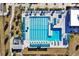 Aerial view of the community pool, with marked lanes, surrounding sun shades and lounge chairs at 1238 James Ln, Kissimmee, FL 34759