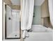 Bathroom featuring a walk-in shower, soaking tub, and coordinated fixtures for a luxurious bathing experience at 1238 James Ln, Kissimmee, FL 34759