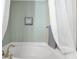 Serene bathroom with a soaking tub, soft lighting, decorative accents, and a tranquil spa-like atmosphere at 1238 James Ln, Kissimmee, FL 34759