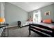 Bedroom with two twin beds, colorful bedding, and a large window at 1238 James Ln, Kissimmee, FL 34759