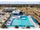 Aerial view of the community pool with lounge chairs and sun shades at the recreation center at 1238 James Ln, Kissimmee, FL 34759