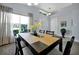 Cozy dining area with natural light, decor and an inviting table, perfect for enjoying meals with Gathering at 1238 James Ln, Kissimmee, FL 34759