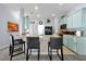Well-appointed kitchen with bar seating, modern appliances, and decor at 1238 James Ln, Kissimmee, FL 34759