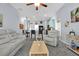Open-concept living room with kitchen, bar seating, and modern decor at 1238 James Ln, Kissimmee, FL 34759