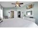 Spacious main bedroom offering ample natural light, ceiling fan, en-suite bathroom access, and comfortable furniture at 1238 James Ln, Kissimmee, FL 34759