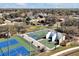 Overhead view of tennis and basketball courts with players at the community recreation center at 1238 James Ln, Kissimmee, FL 34759