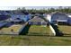 Aerial view of home with fenced yard, patio and lake view at 1524 Venice Ln, Davenport, FL 33896