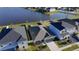 Aerial view of home with lake view and fenced yard at 1524 Venice Ln, Davenport, FL 33896