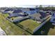 Aerial view of home with fenced yard, patio and lake view at 1524 Venice Ln, Davenport, FL 33896