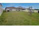 Spacious backyard featuring a covered patio and ample space for outdoor activities at 1524 Venice Ln, Davenport, FL 33896