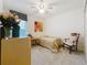 Neutral bedroom featuring a twin bed, ceiling fan, and a bright window at 1524 Venice Ln, Davenport, FL 33896