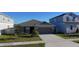 Charming one-story home with a two car garage and well manicured lawn at 1524 Venice Ln, Davenport, FL 33896