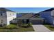 Charming one-story home with a two car garage and well manicured lawn at 1524 Venice Ln, Davenport, FL 33896