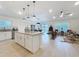 Open-concept kitchen with granite island, stainless steel appliances, and ample counter space at 1524 Venice Ln, Davenport, FL 33896