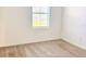 This bedroom has neutral carpet and a window to allow lots of natural light to come in at 1613 Pelican Dr, Davenport, FL 33896