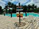 Resort-style community pool with ample lounge seating and tropical decor at 1613 Pelican Dr, Davenport, FL 33896