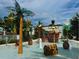 Nautical-themed splash pad with palm trees and interactive water features at 1613 Pelican Dr, Davenport, FL 33896