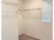 Walk-in closet with wire shelving and a small window for natural light at 1613 Pelican Dr, Davenport, FL 33896