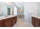 Bathroom features double vanity with tile floors and a glass enclosed shower at 1737 Caribbean View Ter, Kissimmee, FL 34747
