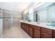Elegant bathroom with double sinks, a walk-in shower, and contemporary finishes for a spa-like experience at 1737 Caribbean View Ter, Kissimmee, FL 34747