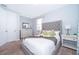Inviting bedroom with a tufted headboard, neutral color palette, and plenty of natural light at 1737 Caribbean View Ter, Kissimmee, FL 34747