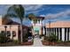Exterior community building featuring a landscaped entrance, signage, and architectural details at 1737 Caribbean View Ter, Kissimmee, FL 34747