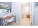 The laundry room includes a modern washer and dryer, desk area, tile floor and natural light at 1737 Caribbean View Ter, Kissimmee, FL 34747