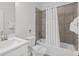 This bathroom features a tiled shower, a toilet, and a modern sink, creating a functional space at 194 Golden Noble St, Davenport, FL 33897