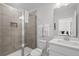 Clean bathroom with a glass-enclosed shower and a modern sink vanity at 194 Golden Noble St, Davenport, FL 33897