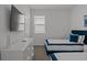 This bedroom includes a large TV, two beds, and a window, creating a comfortable retreat at 194 Golden Noble St, Davenport, FL 33897