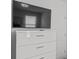 Bright bedroom featuring a sleek white dresser with a large wall-mounted television at 194 Golden Noble St, Davenport, FL 33897