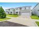 Beautiful two-story home featuring a lovely front yard and a two car garage at 194 Golden Noble St, Davenport, FL 33897
