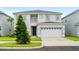 Charming two-story home with landscaped yard and a two car garage at 194 Golden Noble St, Davenport, FL 33897