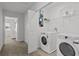 Bright laundry room with modern washer and dryer, offering convenience and functionality at 194 Golden Noble St, Davenport, FL 33897