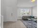 Bright living room with large window and modern furniture at 194 Golden Noble St, Davenport, FL 33897