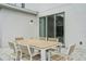 Outdoor patio features a large dining table with seating for eight, perfect for entertaining at 194 Golden Noble St, Davenport, FL 33897