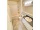 Well-lit bathroom with a shower and tub combination, vanity, and neutral finishes at 19934 Villa Isle # 107, Orlando, FL 32821