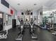 Well-equipped gym featuring elliptical machines, weights, and mirrored walls for a complete fitness experience at 19934 Villa Isle # 107, Orlando, FL 32821