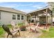 Backyard with a covered patio, fire pit, and outdoor seating at 2559 Eagle Bay Blvd, Kissimmee, FL 34743