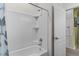 Bathroom featuring a shower and bathtub combo with white tile and a curtain at 2559 Eagle Bay Blvd, Kissimmee, FL 34743