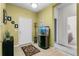 Inviting entryway with a charming aquarium, coat rack and neutral tile flooring at 2559 Eagle Bay Blvd, Kissimmee, FL 34743